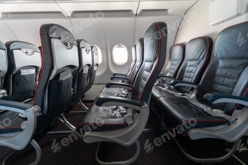 Preview: Airplane seats and windows. Economy class comfortable seats without passengers