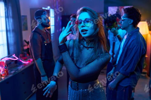 Preview: Young Woman Dancing at Party with Multiethnic young People