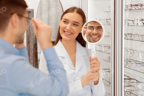 Preview: Optometrist helping man to choose correction glasses