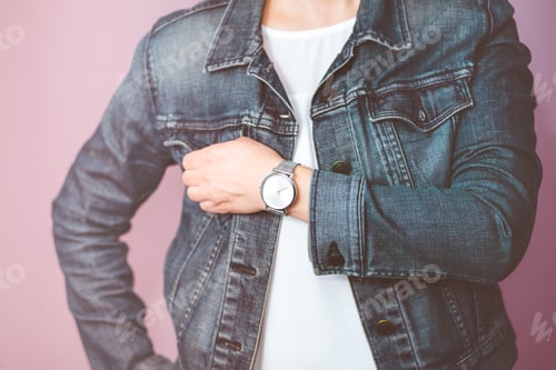 Preview: Young man wearing silver wristwatch and white plain shirt holding cup of coffee