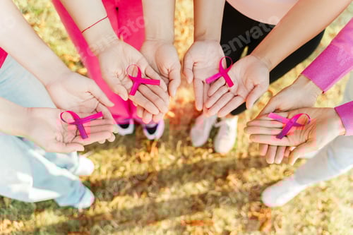 Preview: Women hands holding pink ribbon, copy space. Health care. Breast cancer awareness month concept