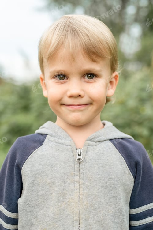 Preview: happy kid boy generation z in countryside on summer holidays. little farmer in nature in the garden