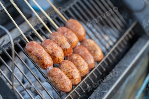 Preview: Grilling Thai sausages pork on stove. Thailand traditional street food.