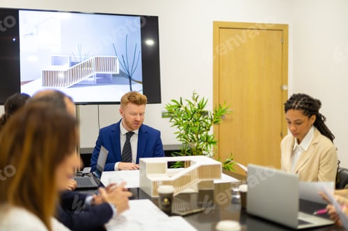 Preview: Architects discussing new building design in meeting room