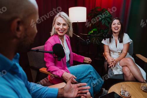 Preview: Content creators broadcasting live podcast interview using microphones