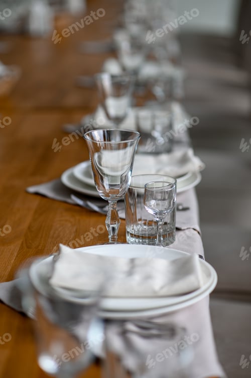 Preview: Festive romantic table setting with silverware, gray napkin and white crockery