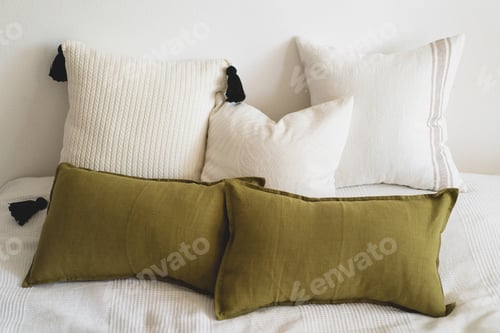 Preview: Comfortable bed with pillows in room. Modern home decor. Interior design. Template.