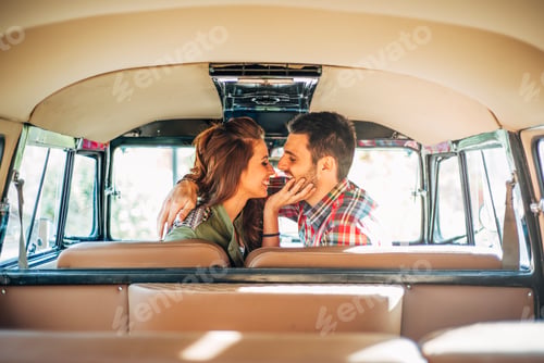Preview: Woman and man enjoy in classic van.