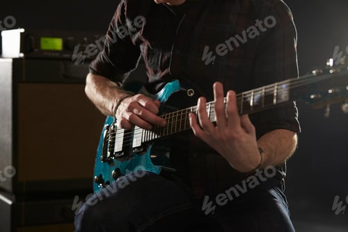 Preview: Close Up Of Man Using Tapping Technique On Electric Guitar