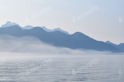 Preview: Fog forming like a shape of the mountain ranges over the ocean.