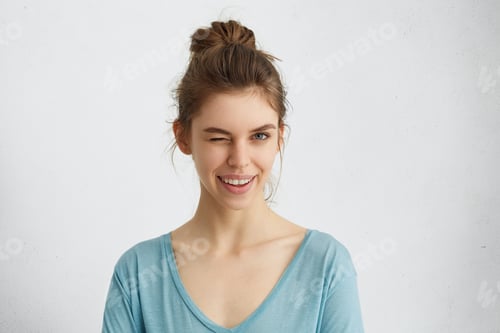 Preview: Woman with Hair in a Bun Winking