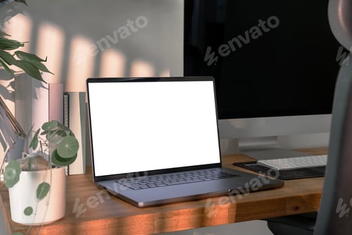 Preview: Open laptop with blank screen on a wooden desk in a home office