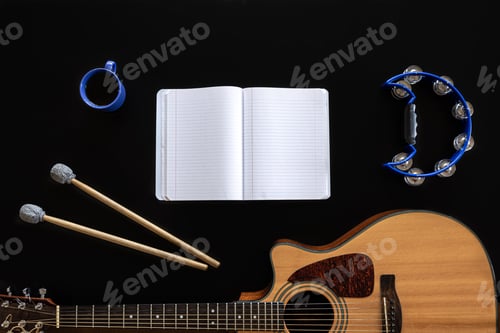 Preview: Music background with notepad and guitar, music creation, creativity.