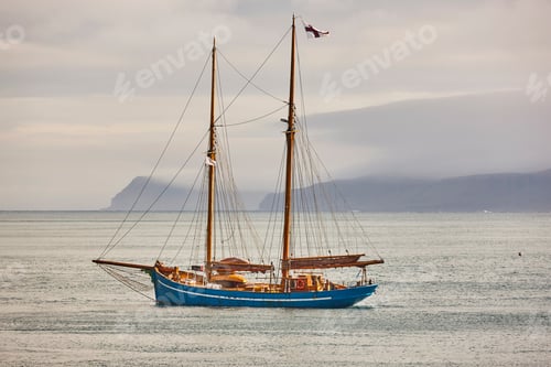 Preview: Yacht sailing on Faroe island fjords. Atlantic ocean coastline. Travelling