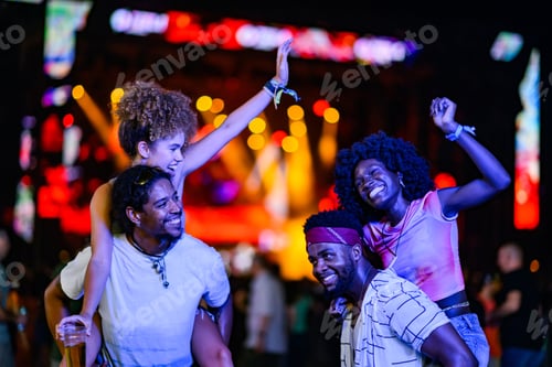 Preview: Friends enjoying a vibrant music festival night