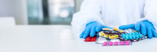 Preview: medicines in the hands of a doctor. Selective focus.