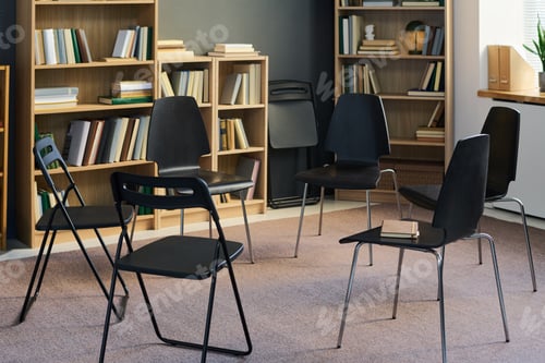 Preview: Chairs Forming Circle in Library Setting Preparing for Group Therapy Meeting