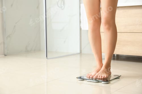 Preview: Woman standing on scales in bathroom, space for text. Overweight problem