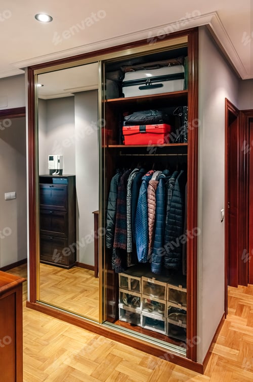 Preview: Interior View of Closet with Wood and Mirrored Doors
