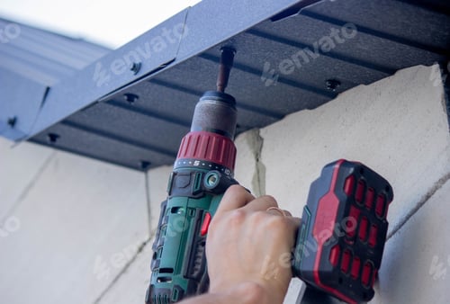 Preview: Power Drill Driving a Screw into Metal Ceiling
