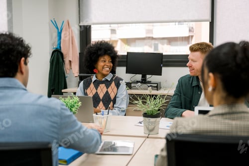 Preview: Diverse business team collaborating during an engaging office meeting