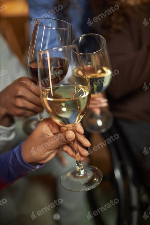 Preview: Hands Holding Wine Glasses and Toasting