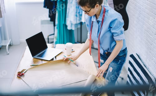 Preview: Crop female designer working in atelier