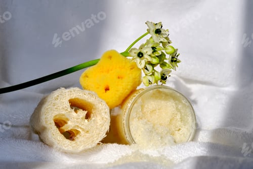Preview: Scrub, loofah washcloth and organic sea sponge on the towel.