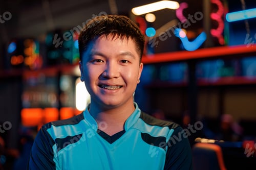 Preview: Esports gamer happy with game at tournament in computer club