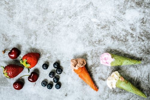 Preview: strawberries cherries and blueberries next to three ice creams in cone