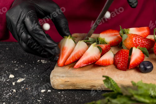 Preview: Cutted fresh strawberries and blueberries. Close up