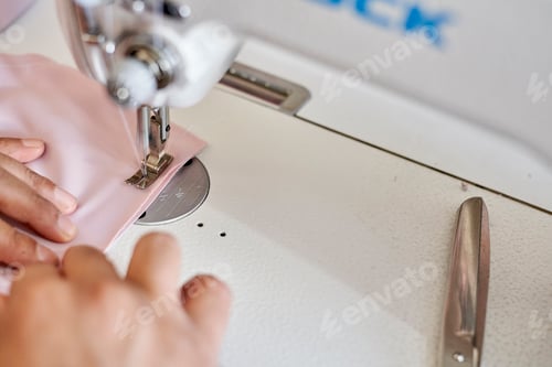 Preview: Closeup shot of a sewing process in the phase of overstitching