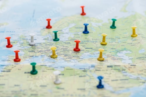Preview: selective focus of colorful push pins on world map