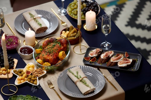 Preview: Plate with Linen Napkin Served on Table Top with Festive Dinner at Christmas