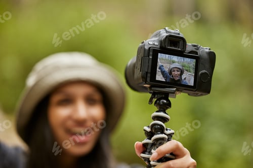 Preview: Cropped shot of an attractive young woman taking selfies while hiking in the wilderness