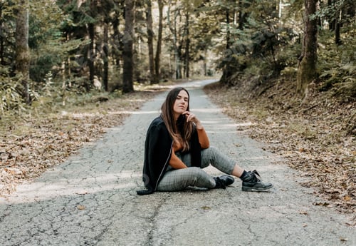 Preview: Shot of a beautiful woman sitting in an autumn forest