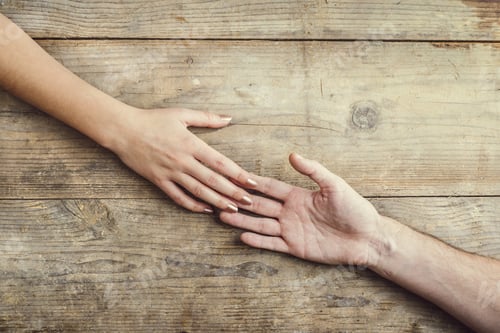 Preview: Hands of man and woman holding together.