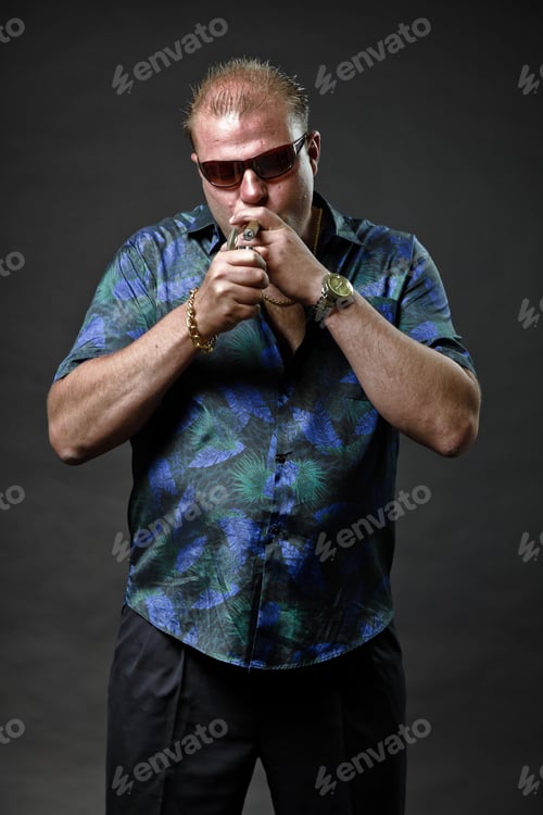Preview: Gangster Mafia Man With Sunglasses In Casual Outfit Smoking Cigar Looking Tough Isolated On Dark
