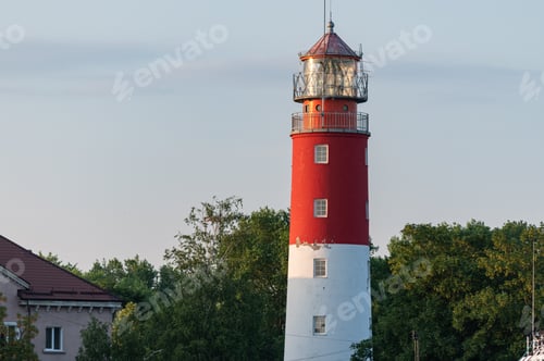 Preview: Lighthouse in seaport. Beautiful russian Baltiysk beacon. Scenery blue sky, copy space.