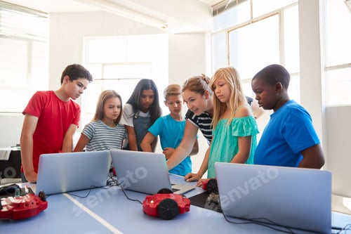Preview: Group Of Students In After School Computer Coding Class Learning To Program Robot Vehicle