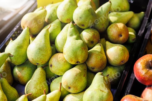Preview: Close-up detail view many fresh juicy green local sweet farmer's pear and apples on street market