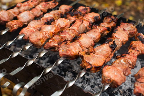 Preview: Meat roasted on fire barbecue kebabs on the grill.
