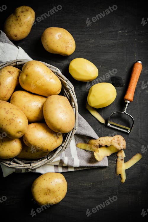 Preview: Fresh potatoes. On black background.