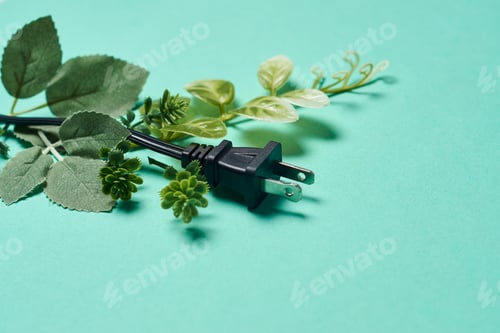 Preview: Electrical connection cable with green needles all around. Green energy trenewable electricity