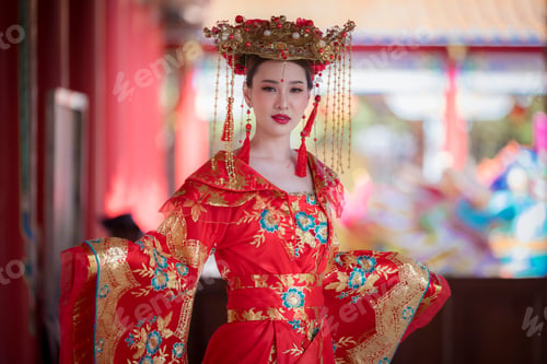 Preview: Portrait happiness young beautiful Asian woman wear red cheongsam dress costume posing happy smiling