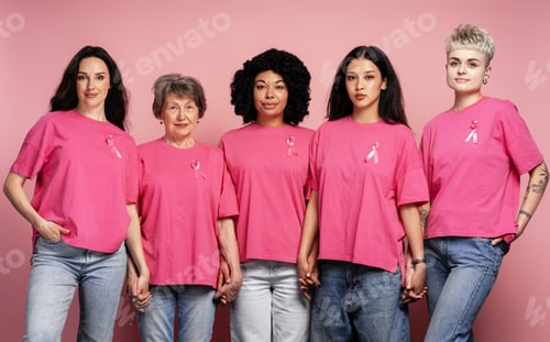 Preview: Women holding hands wearing pink ribbons for breast cancer awareness