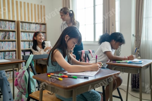 Preview: Group of student learn with teacher in classroom at elementary school.