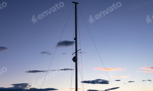 Preview: Mast of a sailing boat at sunset, wallpaper and copy space.