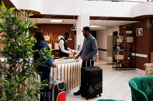 Preview: People waiting at reception for check-in