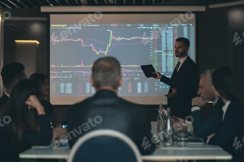 Preview: The man standing near the screen on the business meeting.
